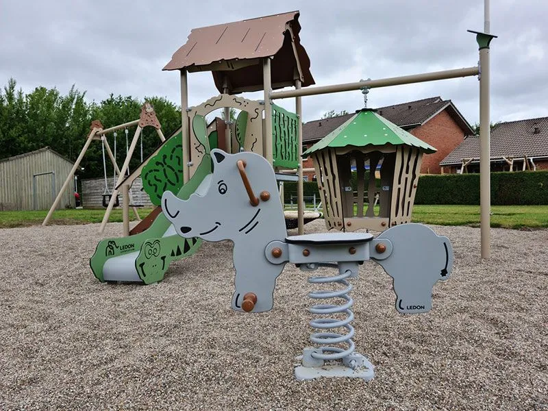 Feather rocking animal rhinoceros in a playground Feather rocking animal rhinoceros in a playground